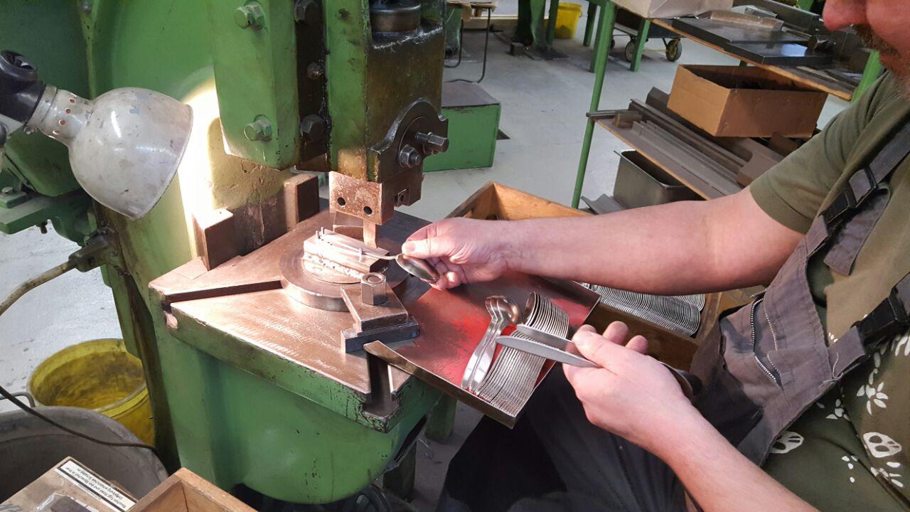 Power press placing the hallmark